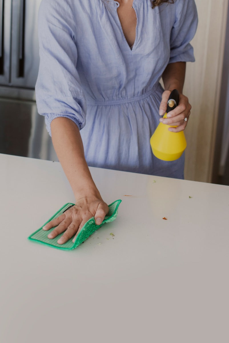 Person cleaning kitchen benchtop with ENJO Kitchen Allpurpose Cloth