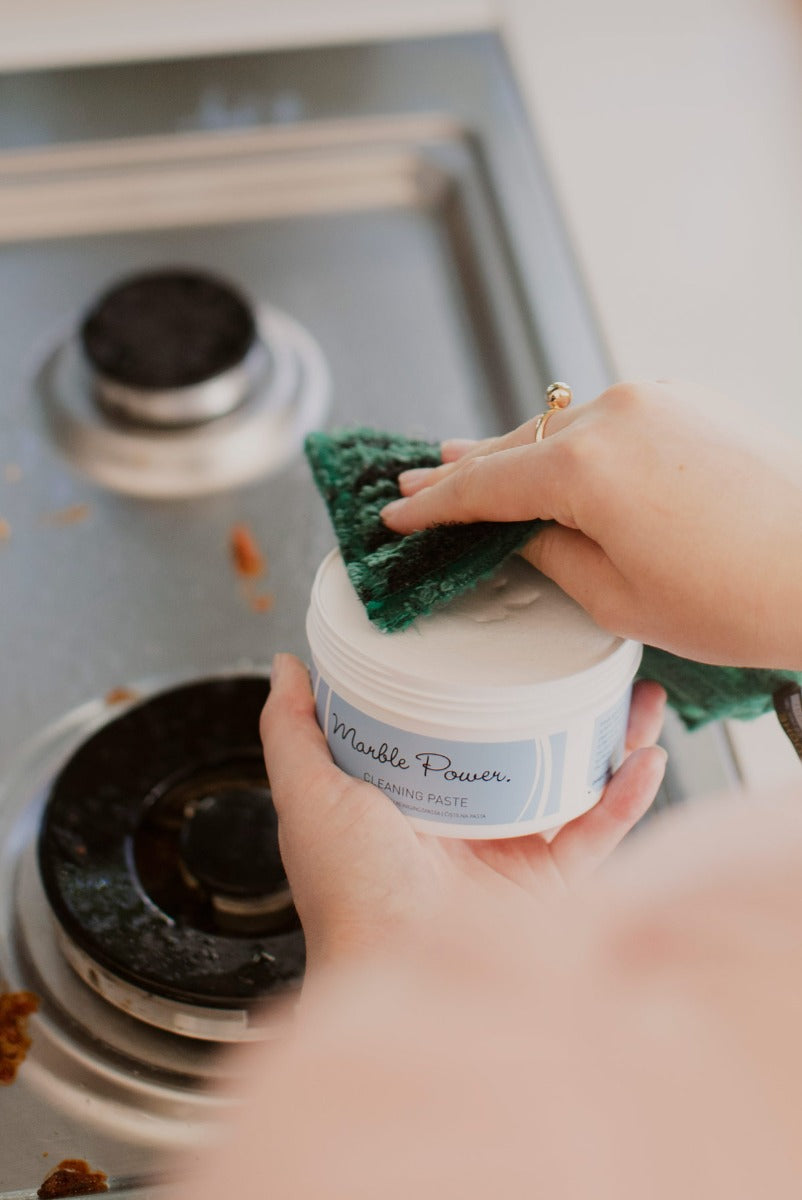 Person putting ENJO Marble Paste onto the ENJO Kitchen Mini