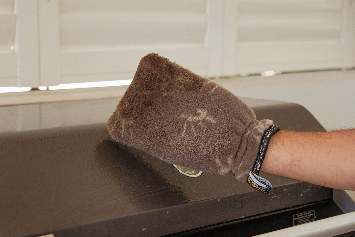 Person showing dirty ENJO Outdoor Glove