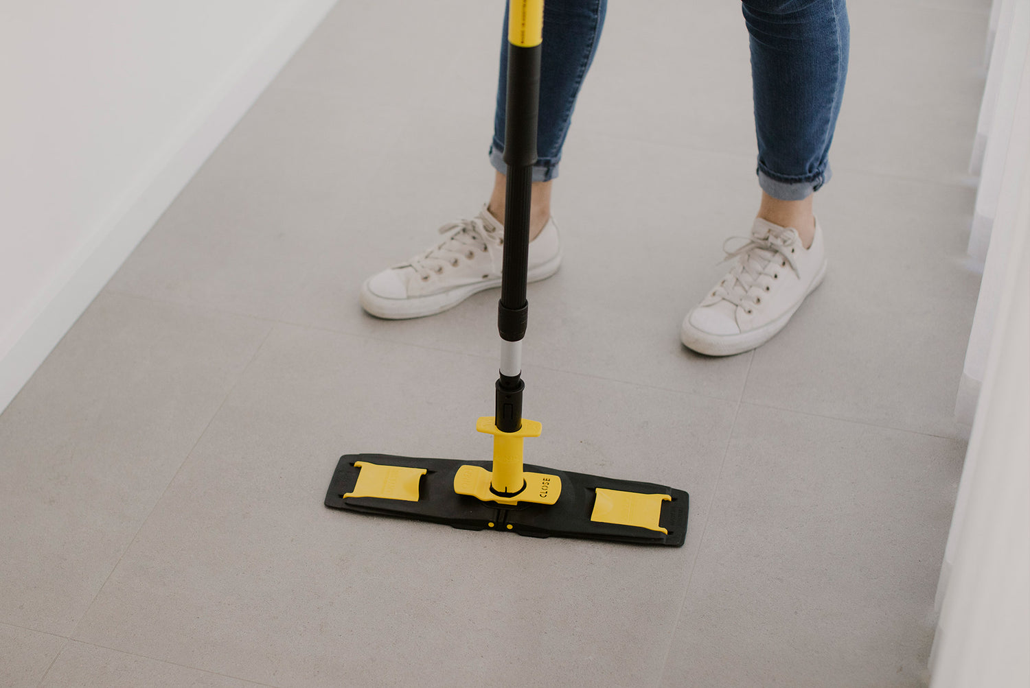 Floorcleaner in parked position with person standing behind