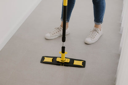 Floorcleaner in parked position with person standing behind