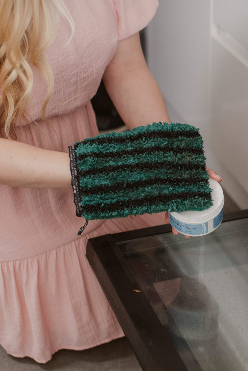 Person putting ENJO Marble Paste onto the ENJO Kitchen Glove